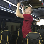 Fitter working on a roof window in a Mercedes Sprinter