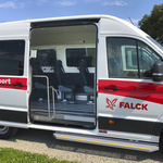 Red-white minibus for patient transport